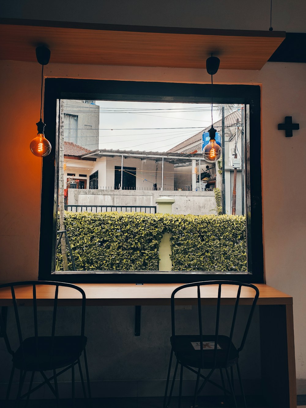 a table and chairs in front of a window