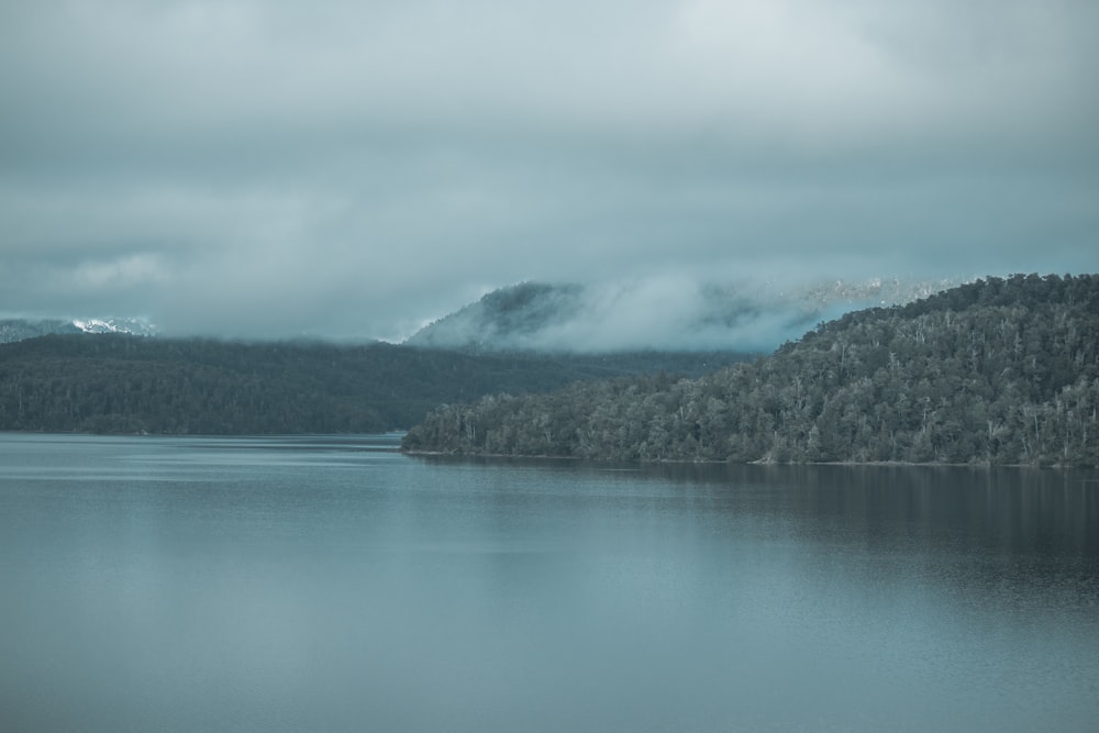 a lake with mountains in the background