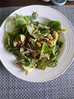 Bright salad with mixed greens, cherry tomatoes, and avocado slices