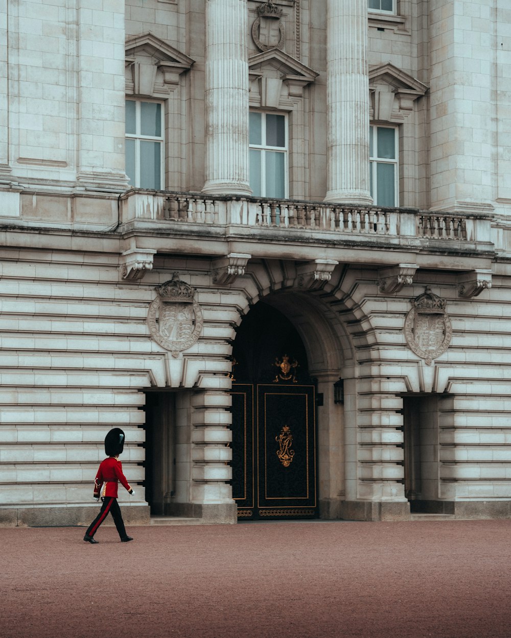 a person walking in front of a building