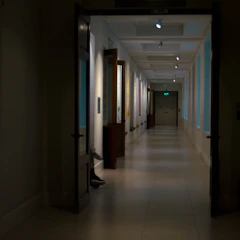 View of the corridor outside the rooms with soft lighting.