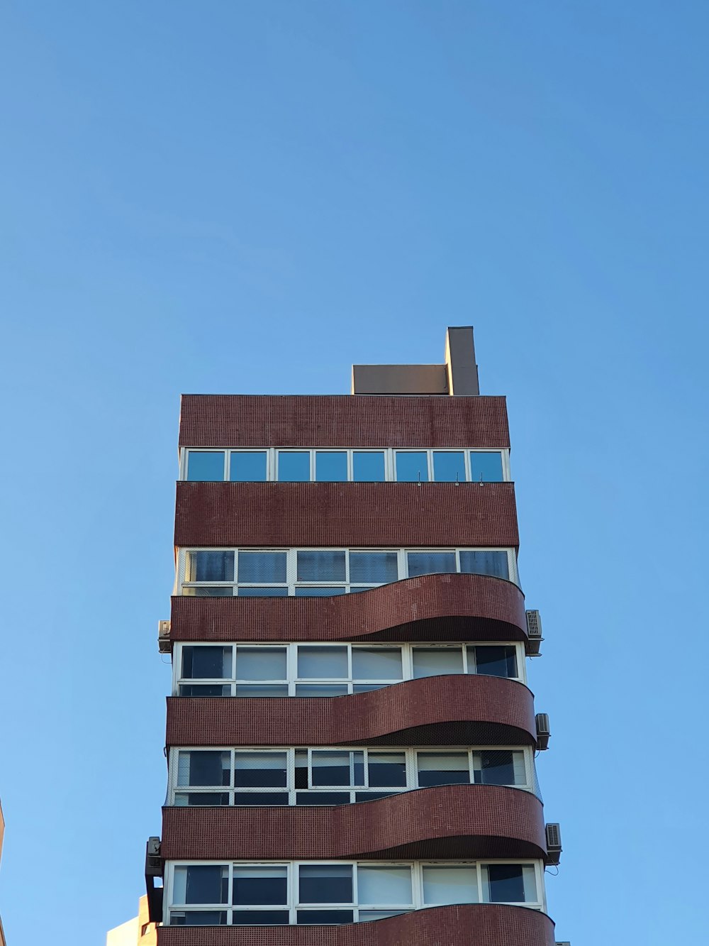 a tall building with a blue sky