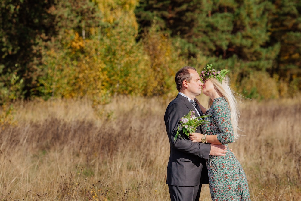 a man and woman kissing