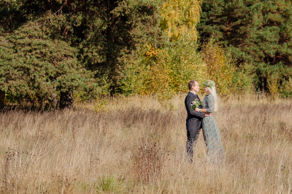 a man and woman in a field