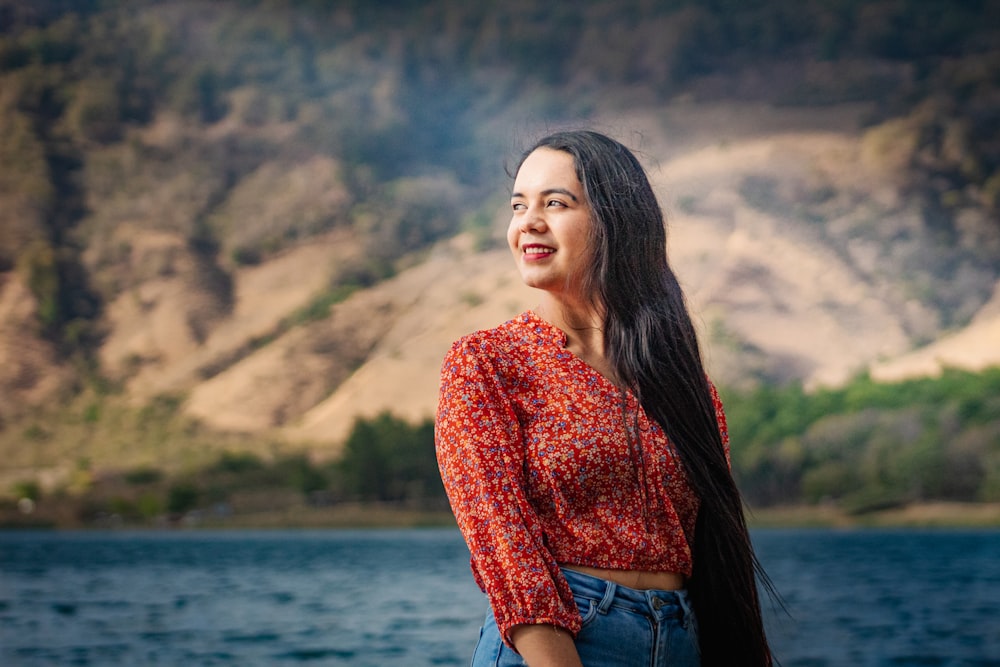 a person standing by a body of water