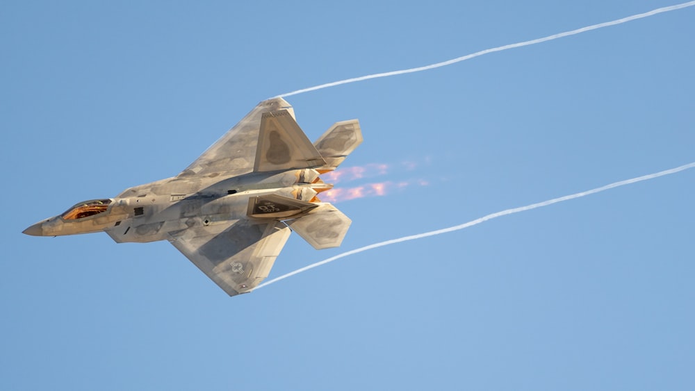 a fighter jet flying in the sky