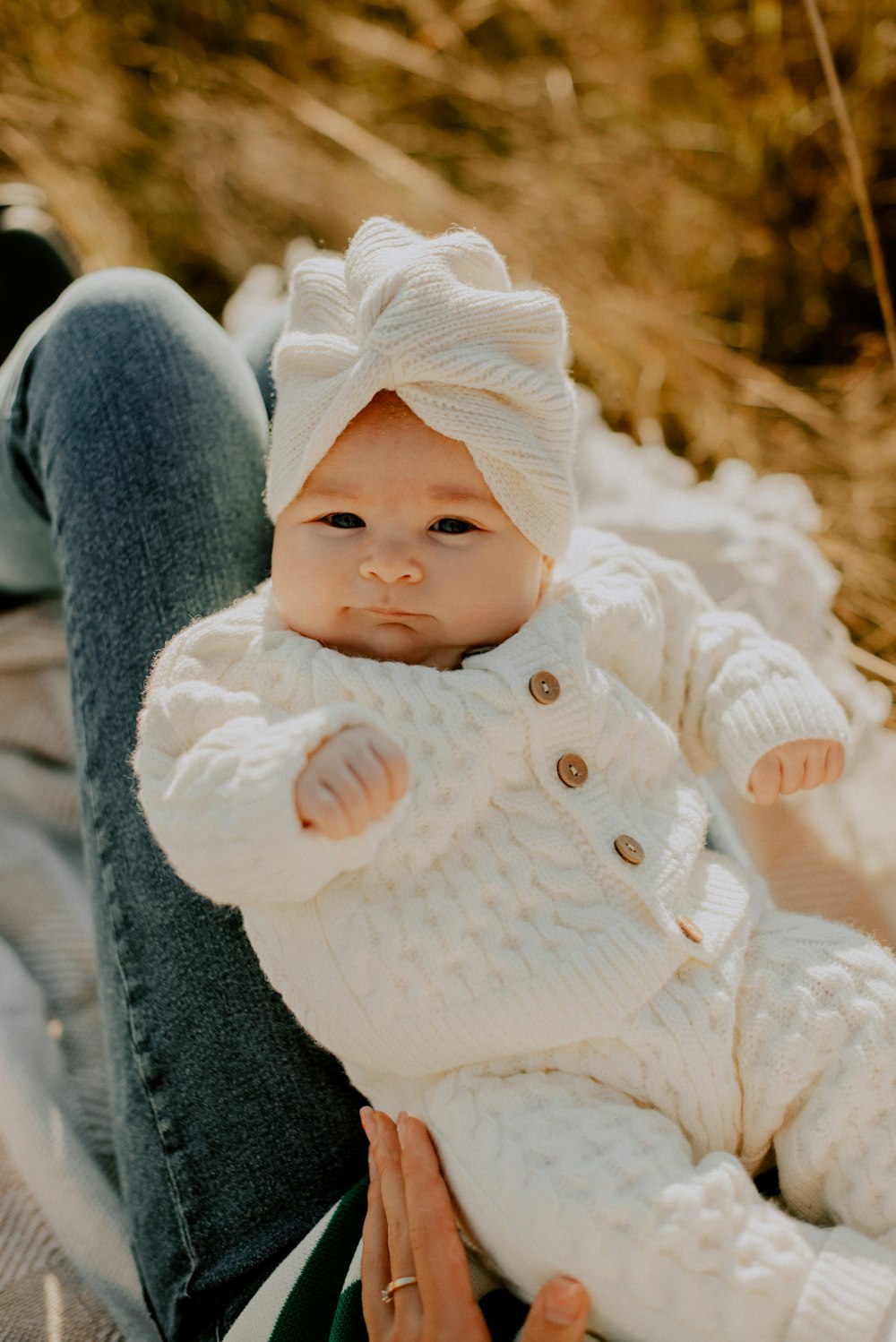 a close up of a baby holding a stuffed animal