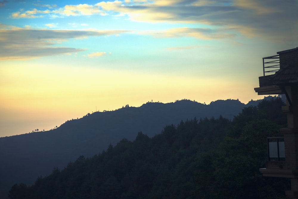 a view of a mountain range and a sunset