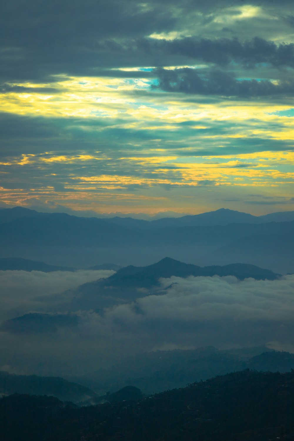 a view of the mountains and clouds