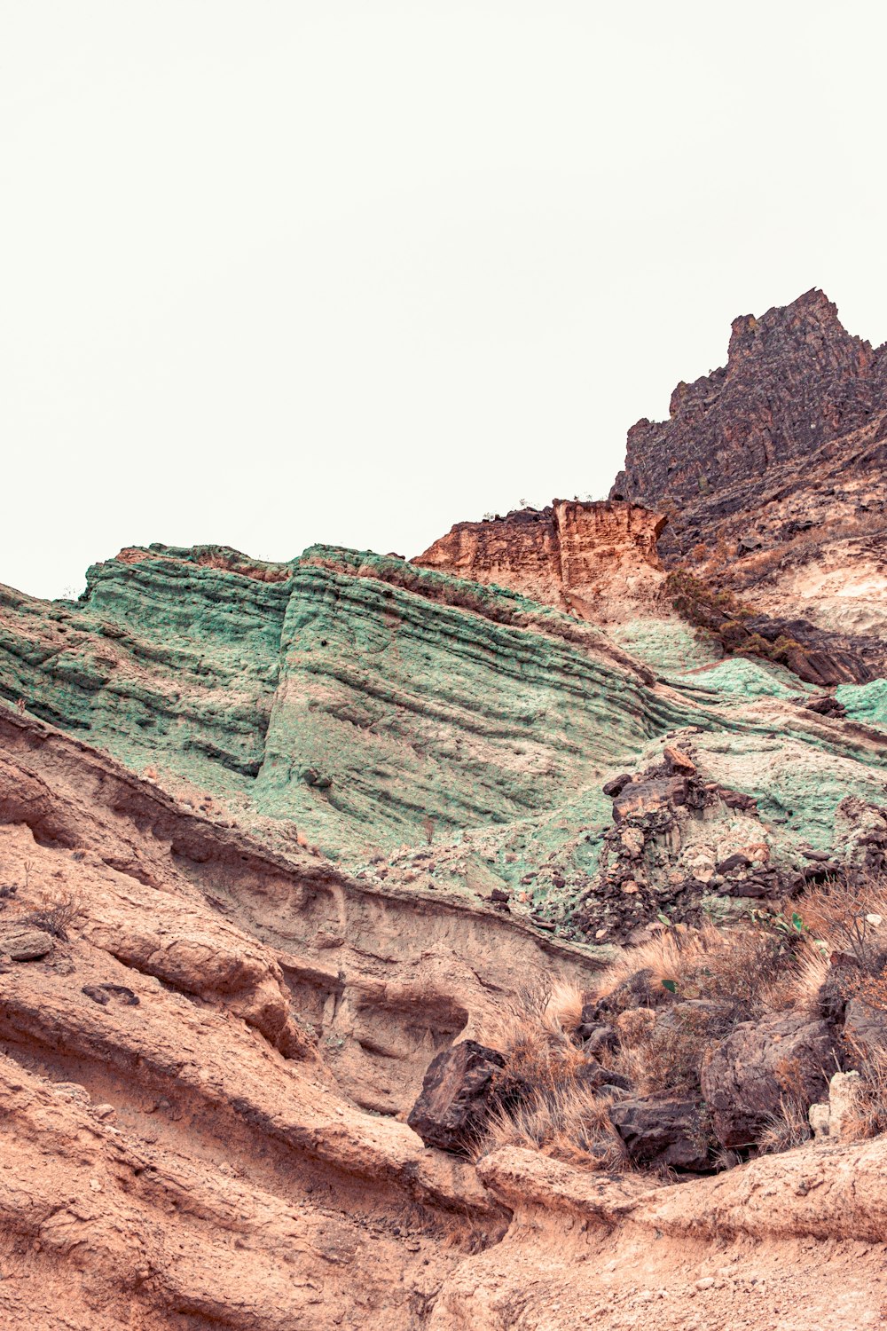 a rocky canyon with a bridge