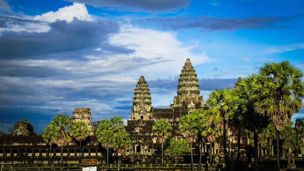 a building with towers and trees