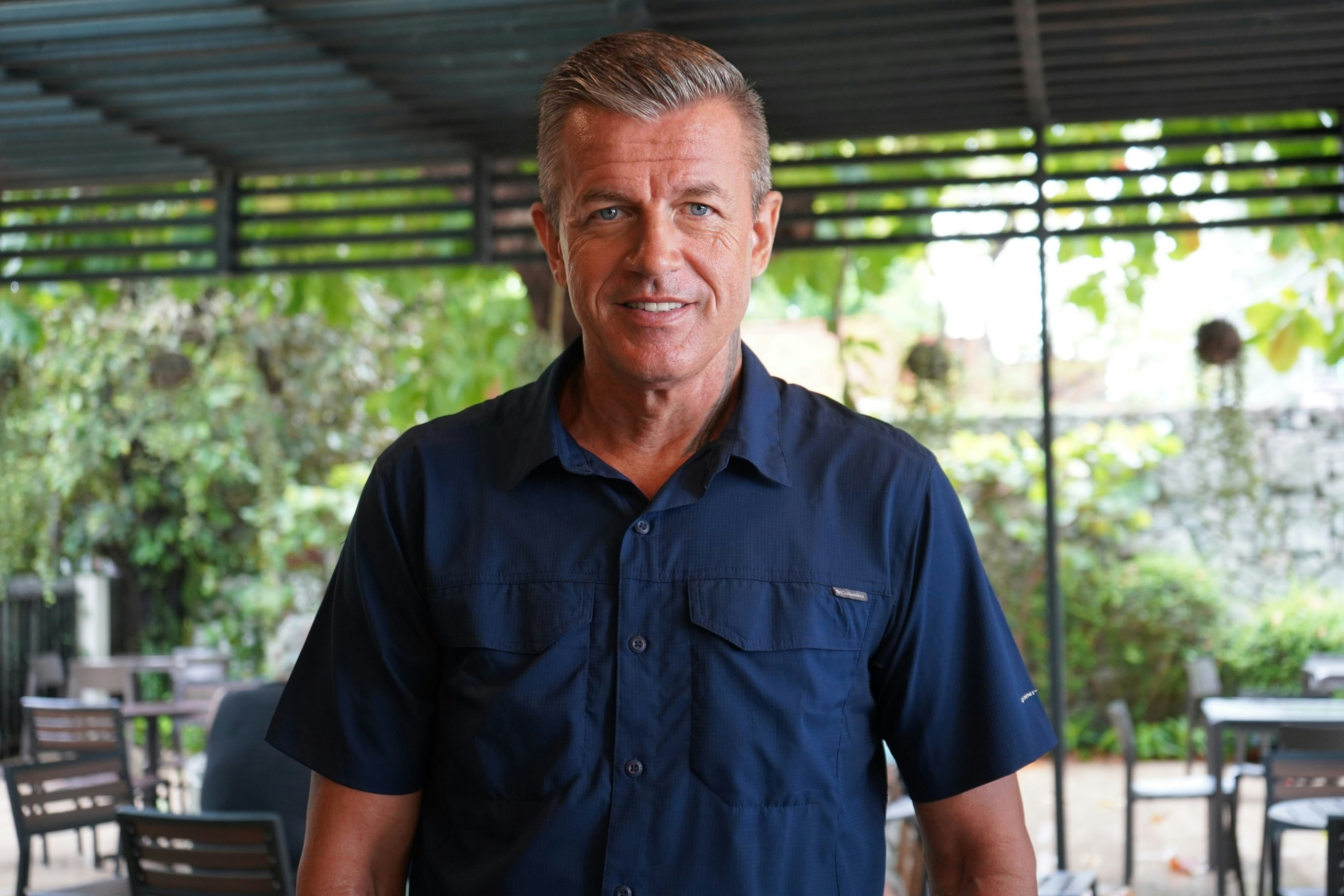 a man in a blue shirt