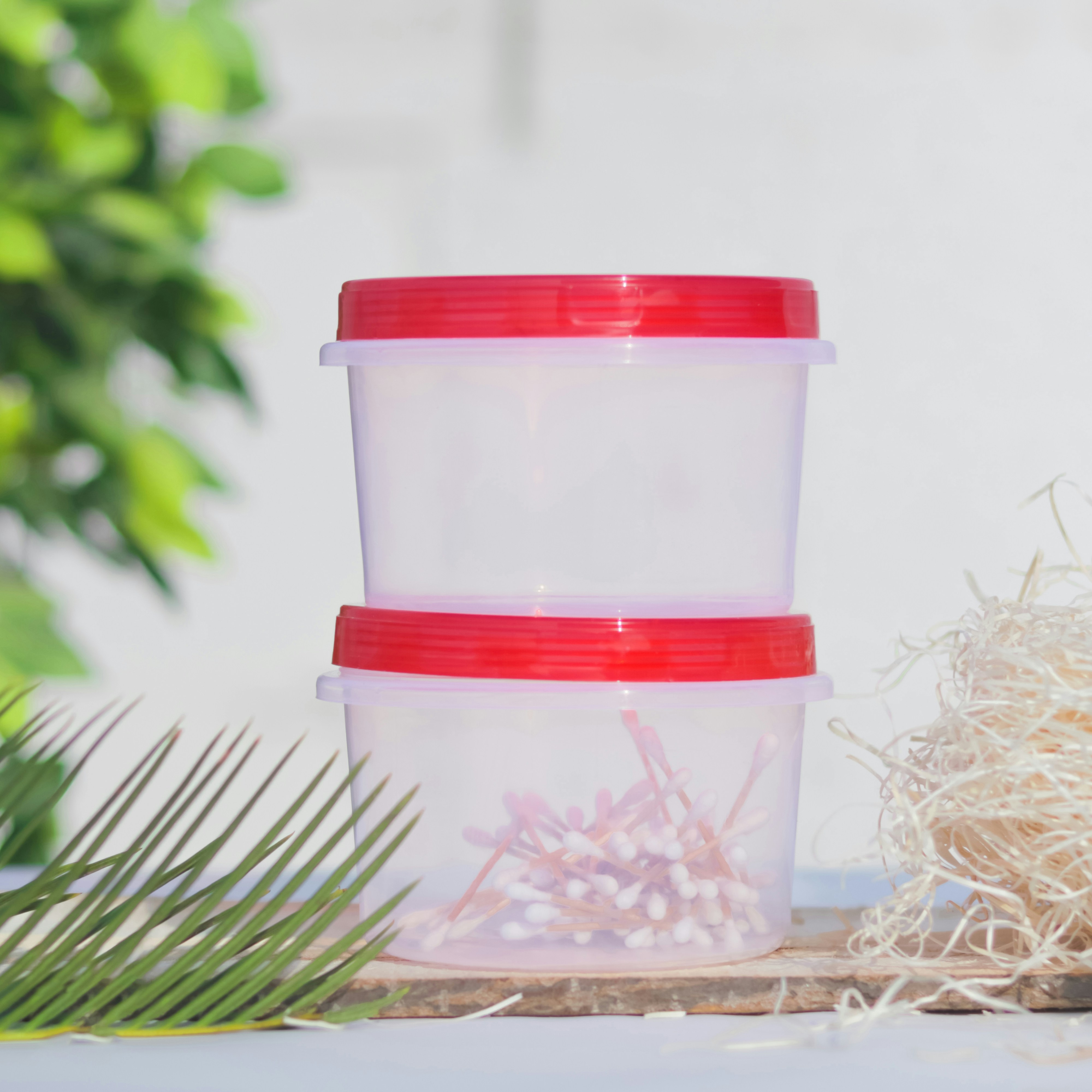 a white container with a red lid
