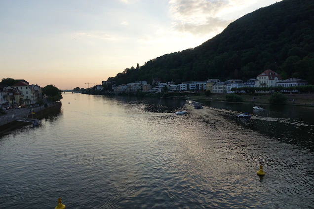 A serene riverside view at sunset with the hotel’s cozy rooms overlooking the calm Ganga river.