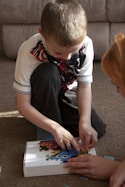 a boy playing with a toy