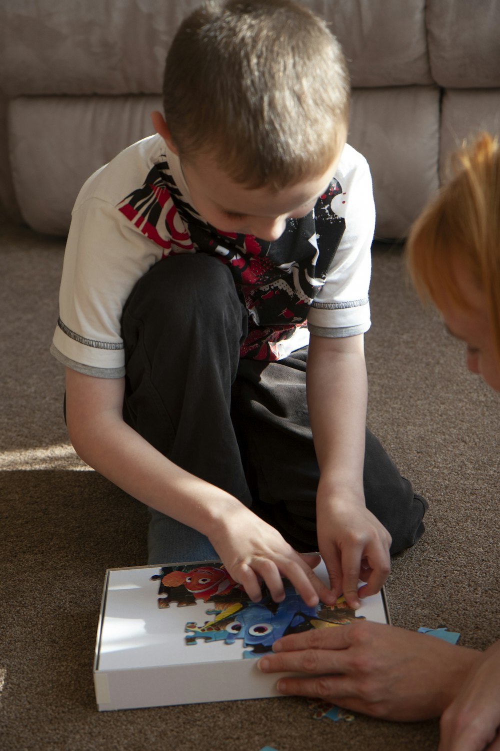 a boy playing with a toy