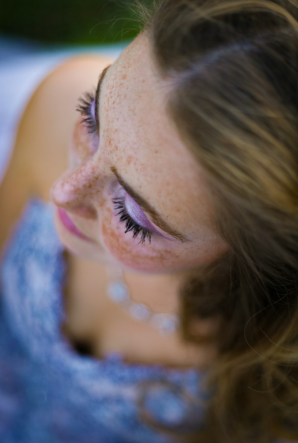 a woman with her eyes closed