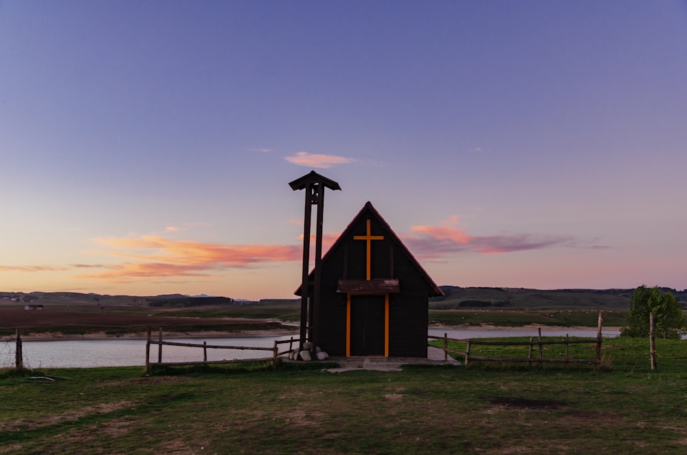 a small building with a windmill