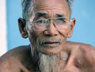 a man with a beard and glasses