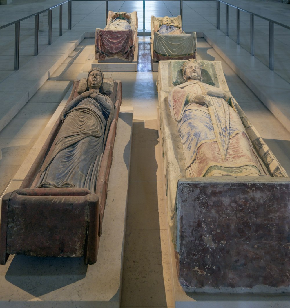 a group of statues on a staircase