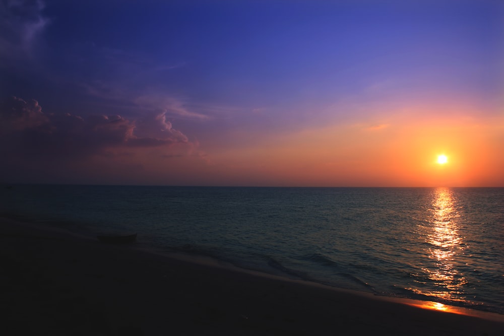 a sunset over a beach