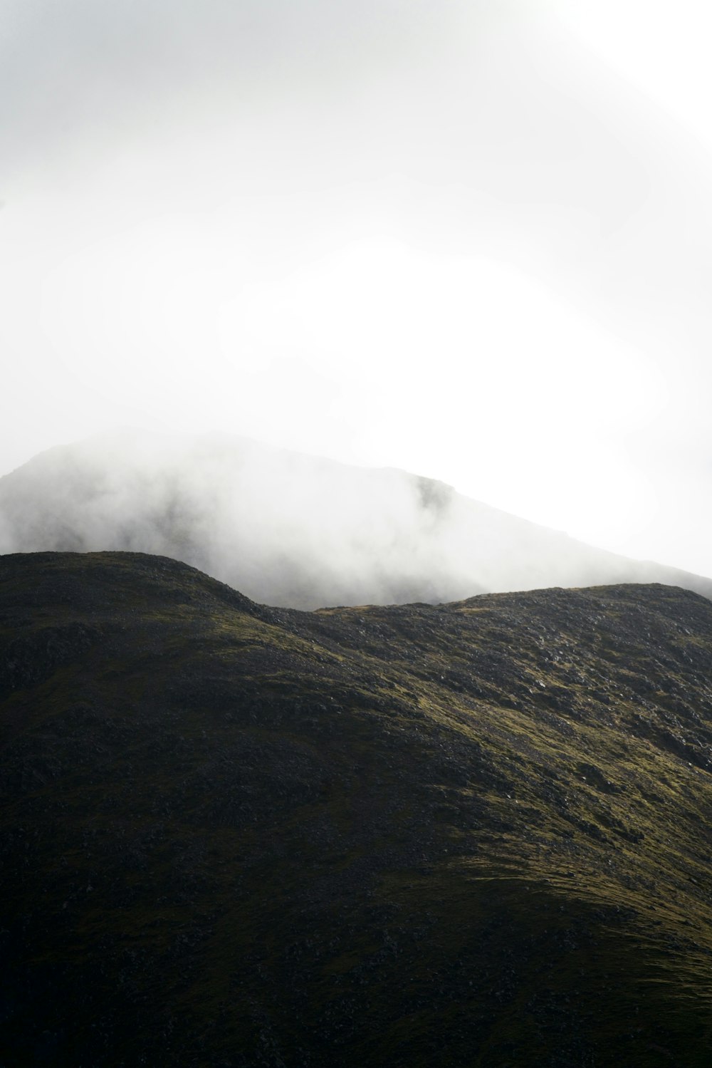 a mountain with clouds