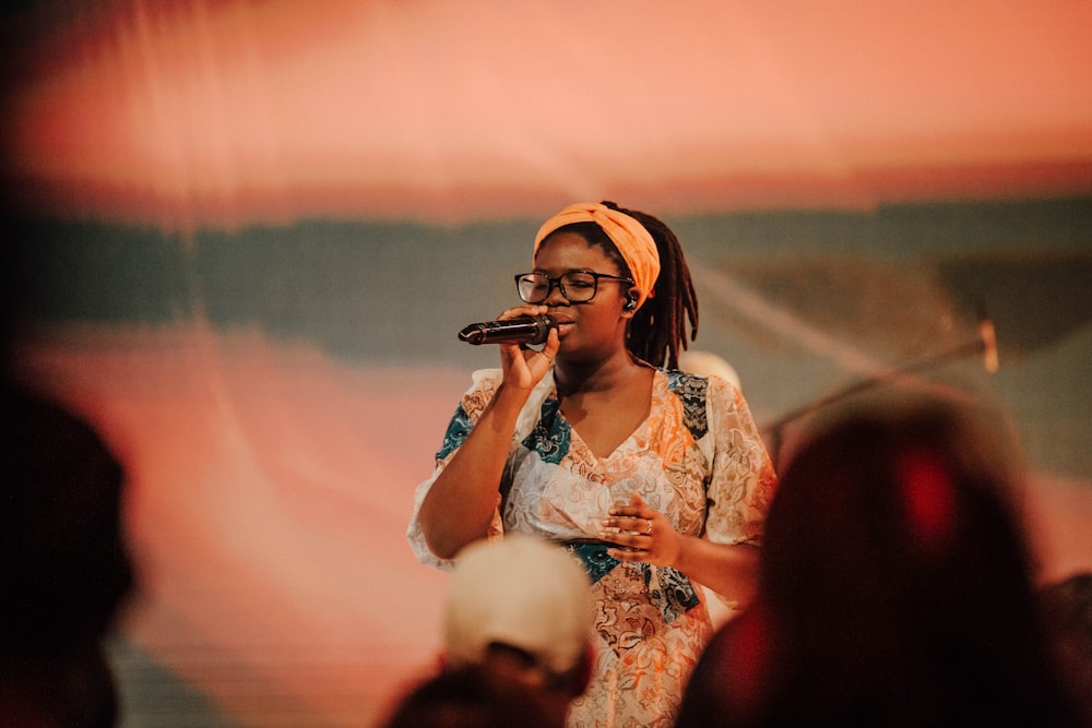 a woman singing into a microphone