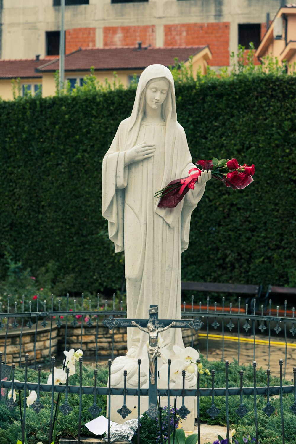 a statue of a person holding flowers