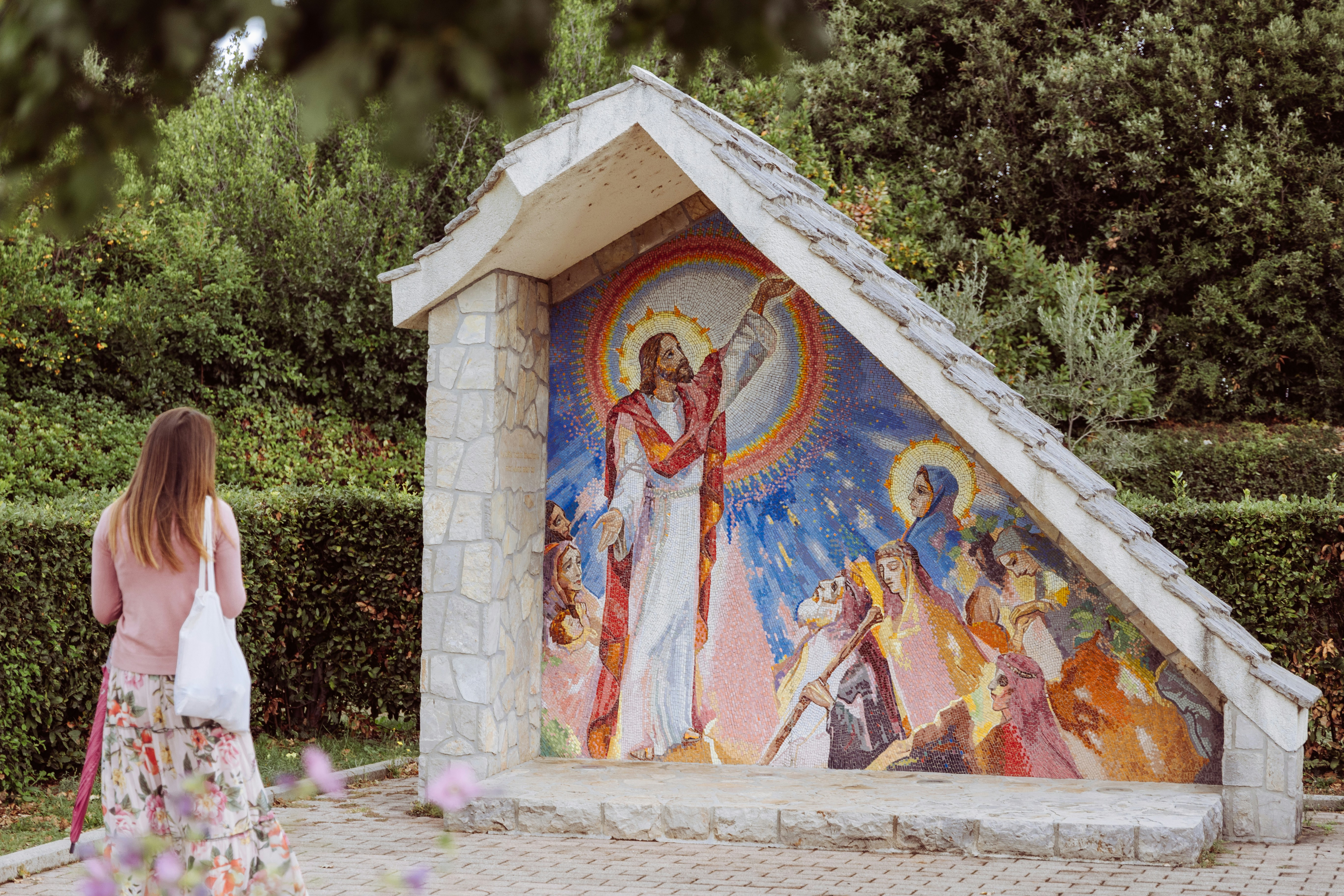 a person looking at a painting