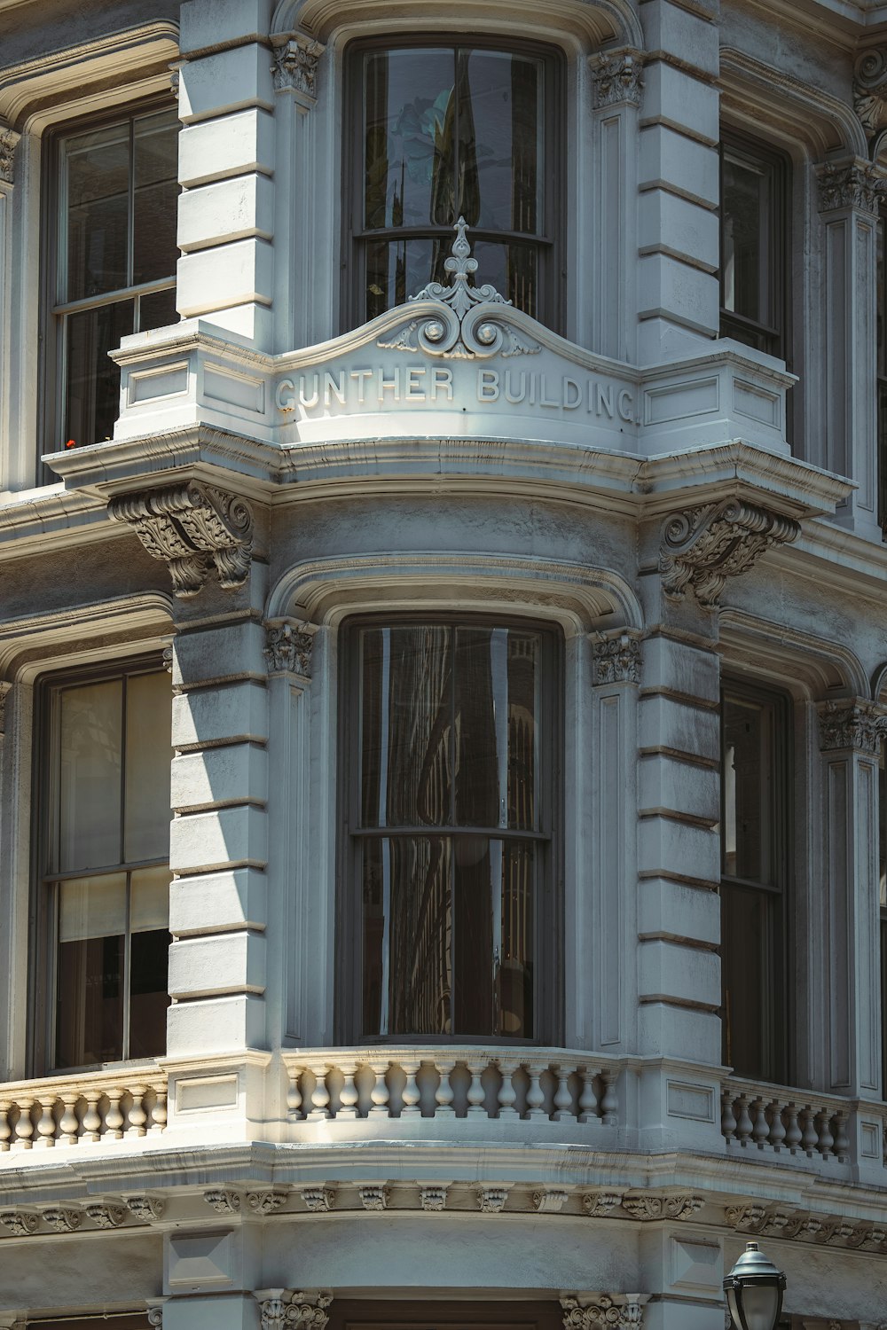 a building with a large door and a statue on the top