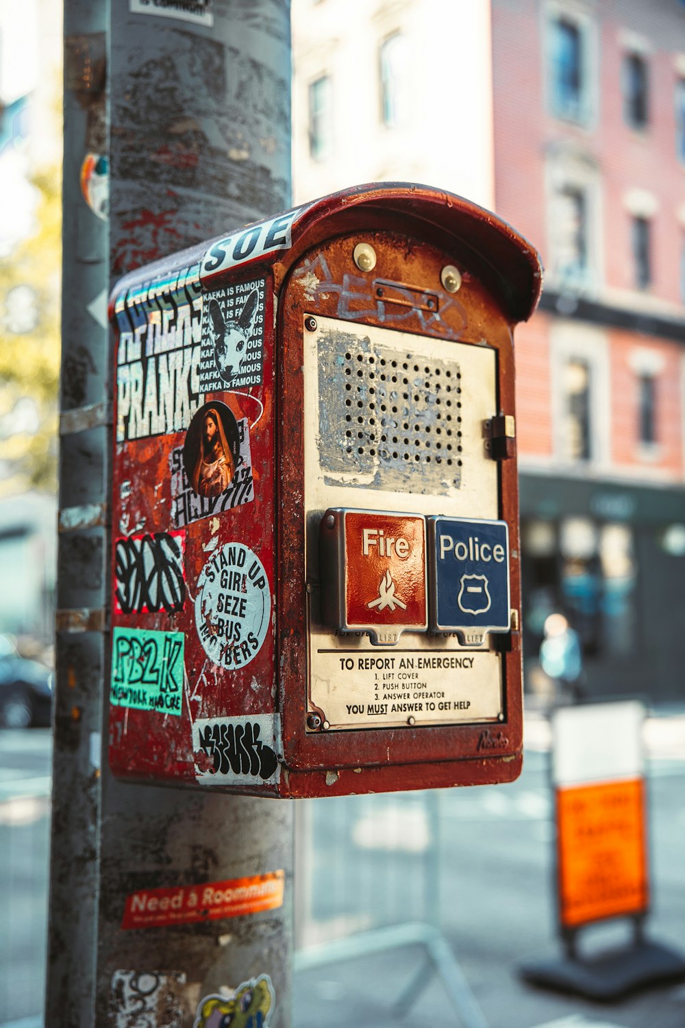 a parking meter has stickers on it