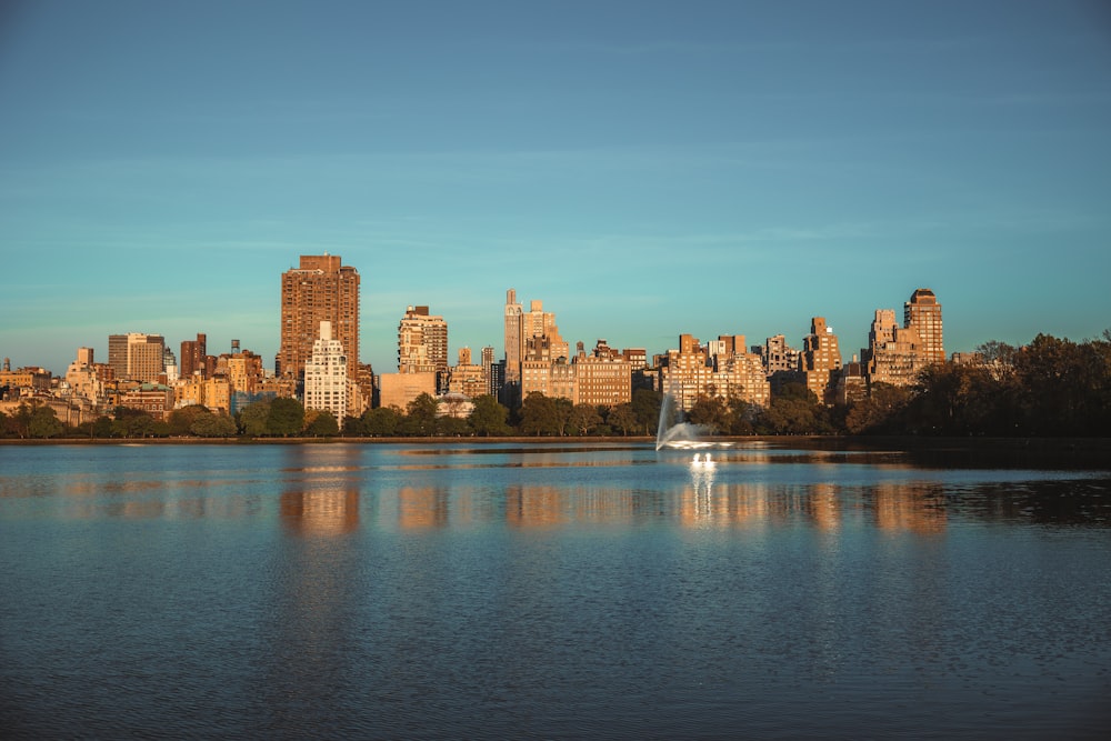 a city skyline across a body of water