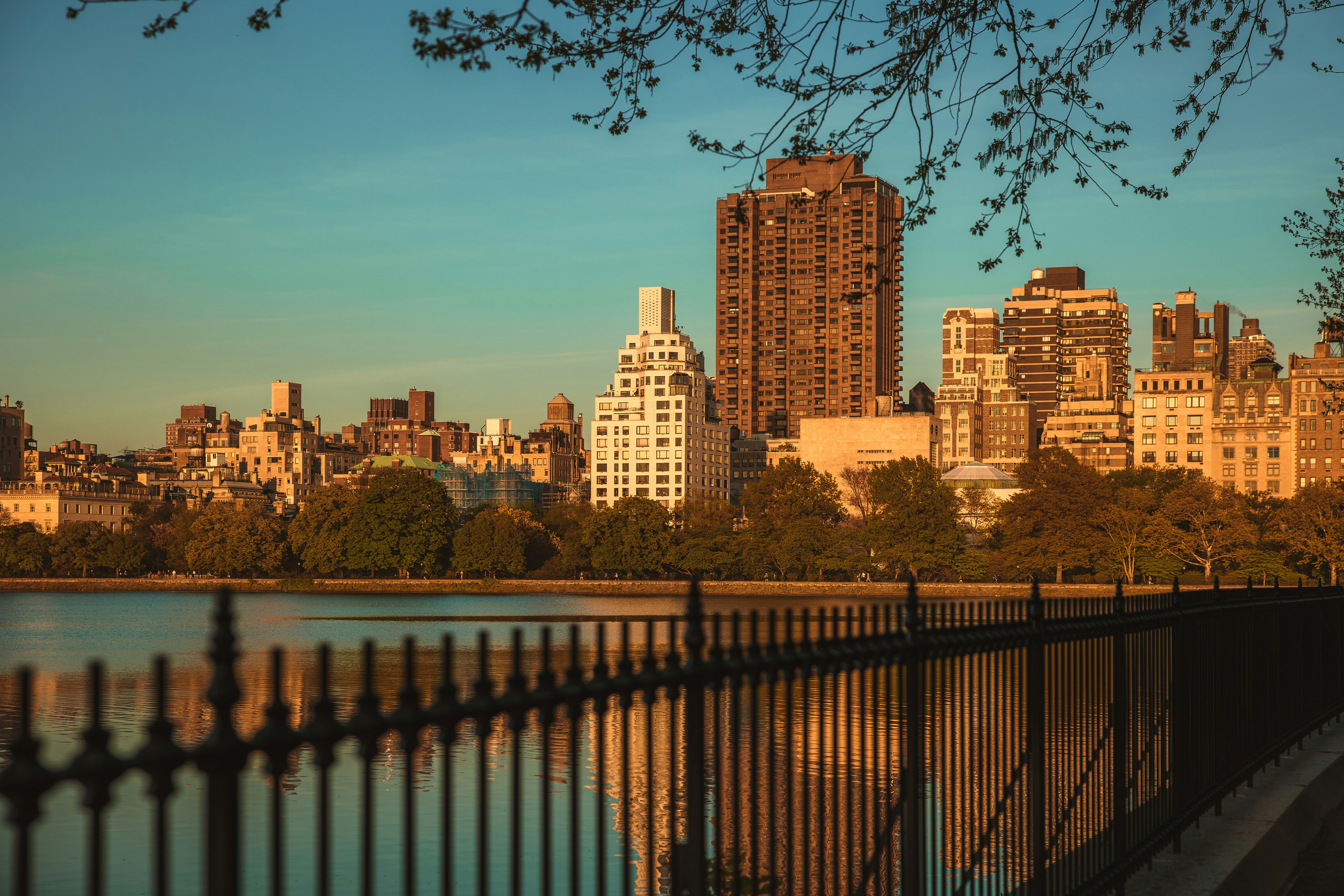 a body of water with buildings in the background, 