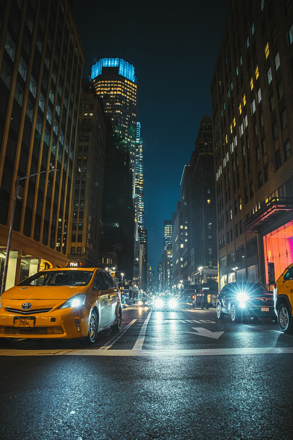 cars on a street at night