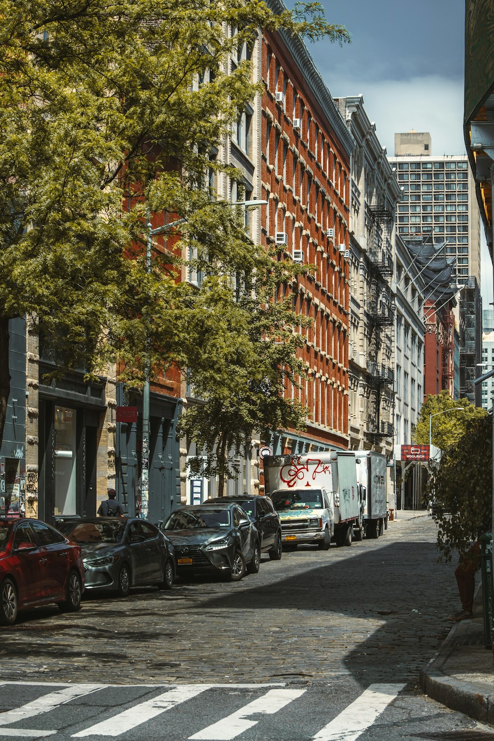 a street with cars and buildings