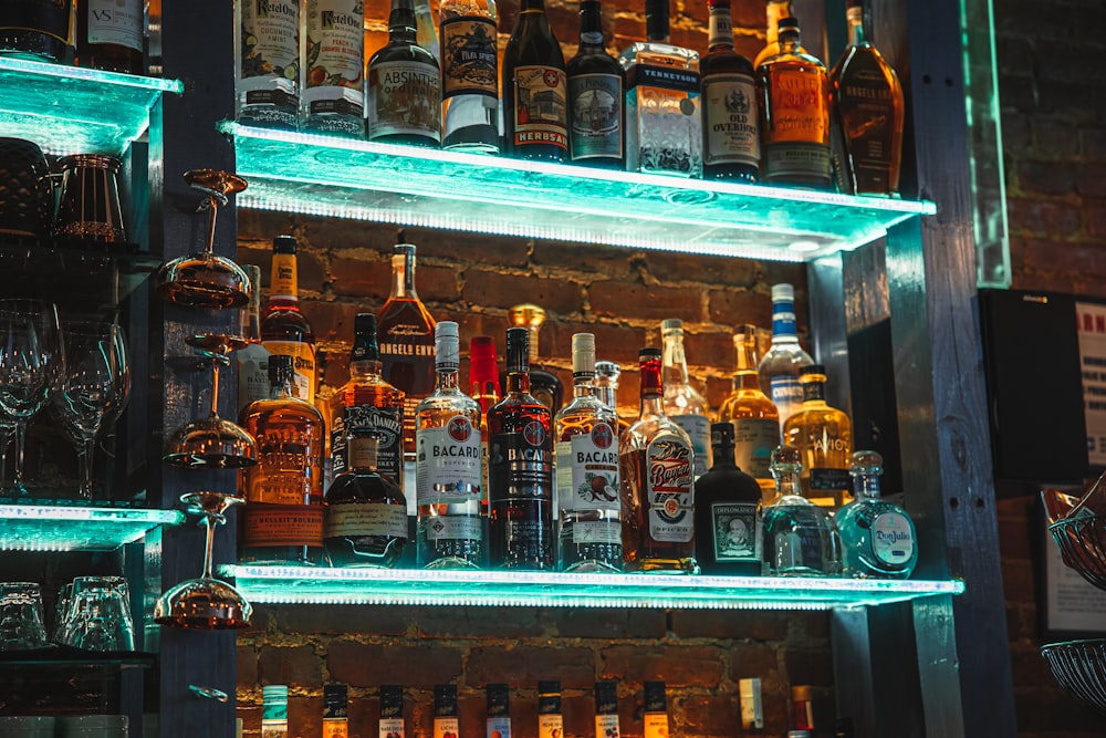 a shelf with bottles of alcohol on it