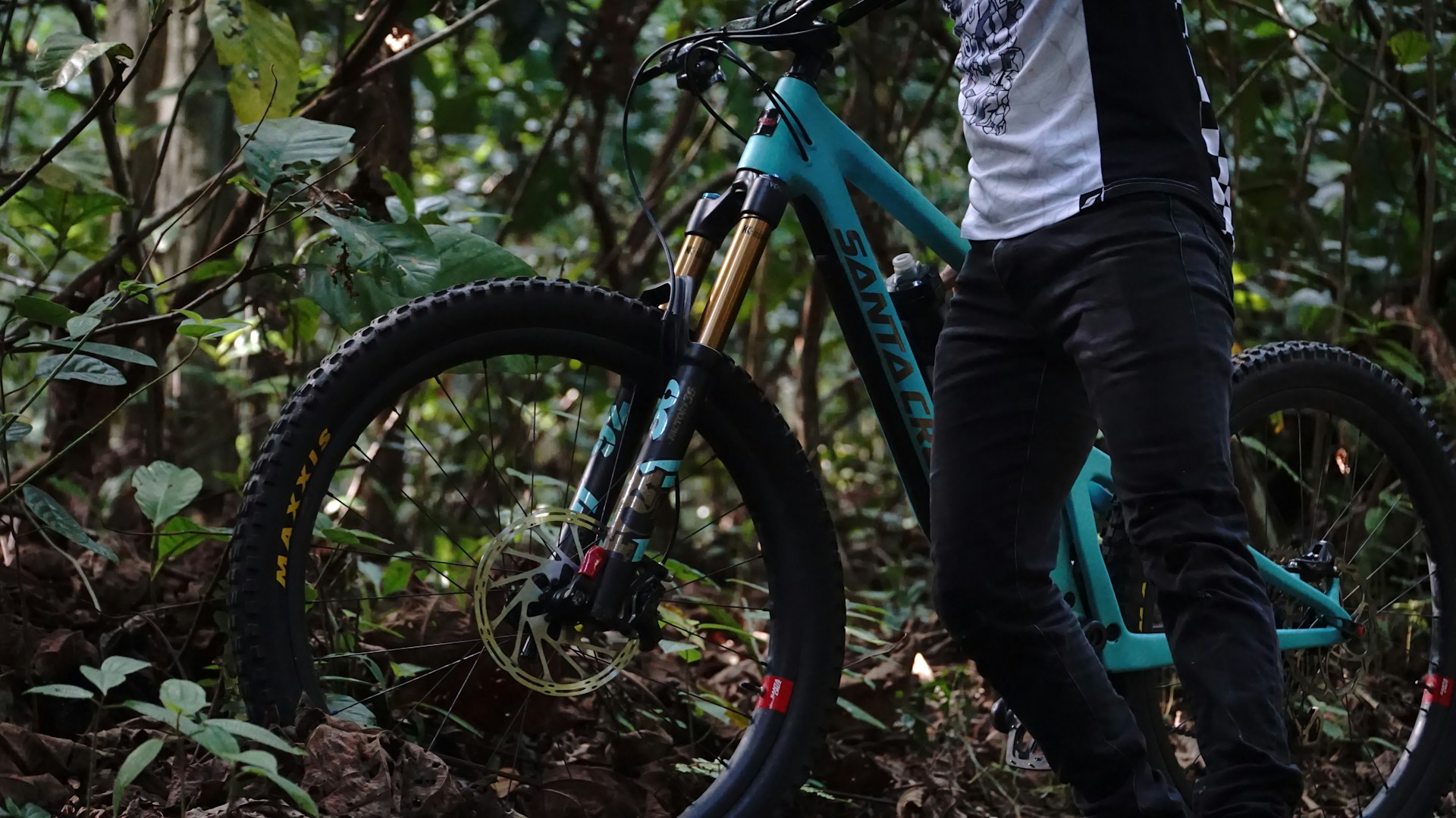 a person standing next to a bicycle