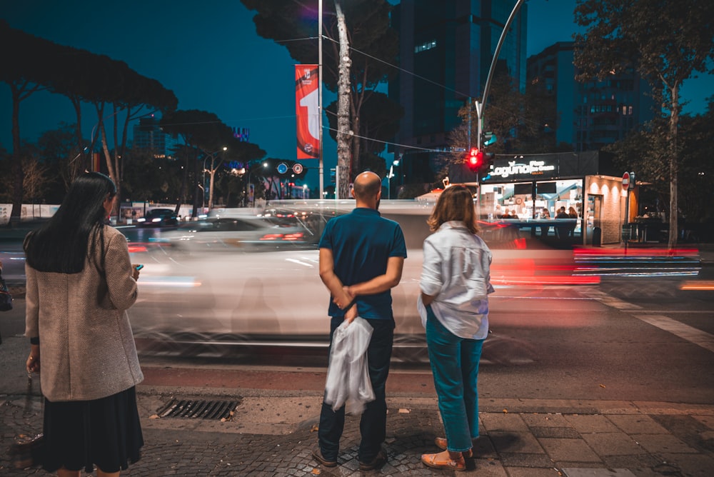 people waiting at a traffic light