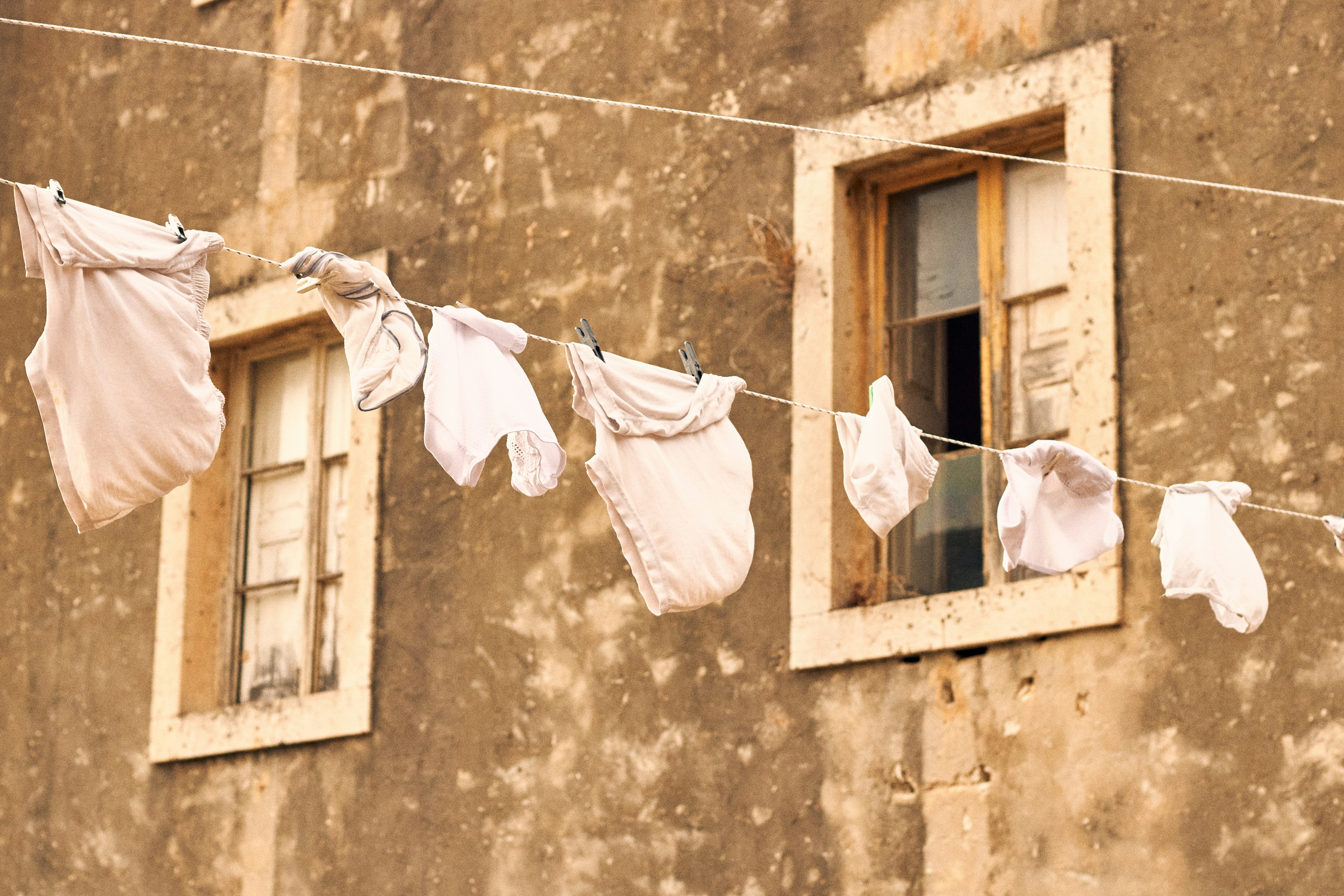 a group of clothes outside of a building