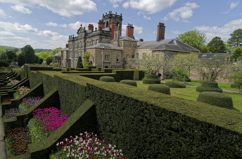 a large house with a garden in front of it