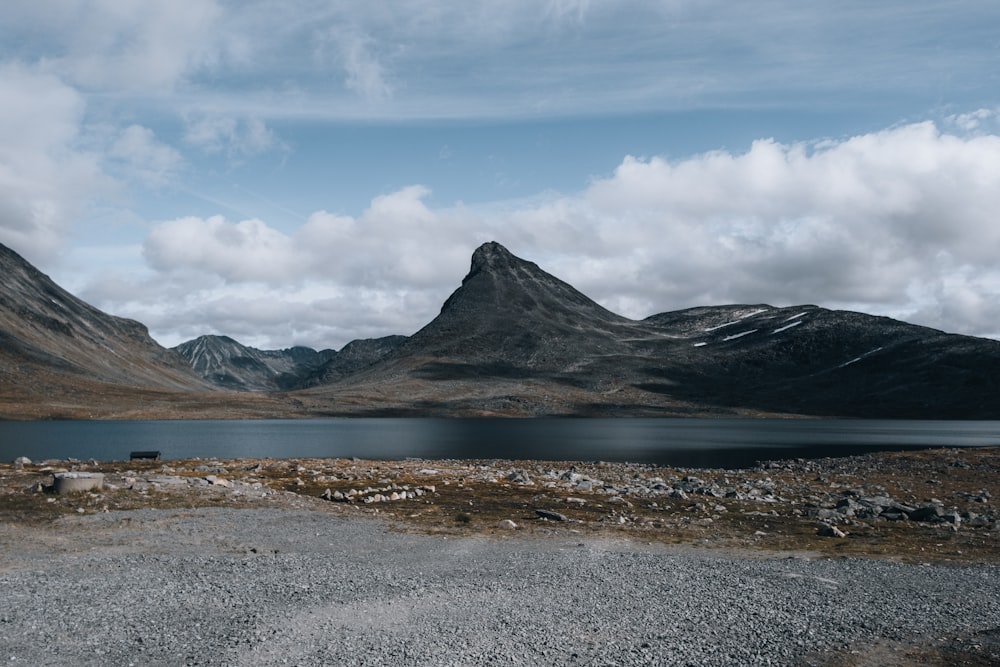 a lake with mountains in the background