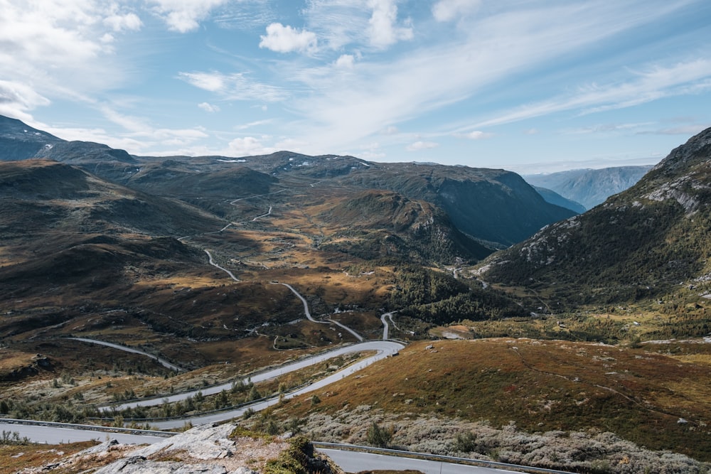 a winding road through a valley