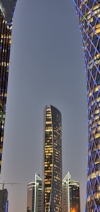 A futuristic city skyline showcasing innovative architecture and digital design elements.