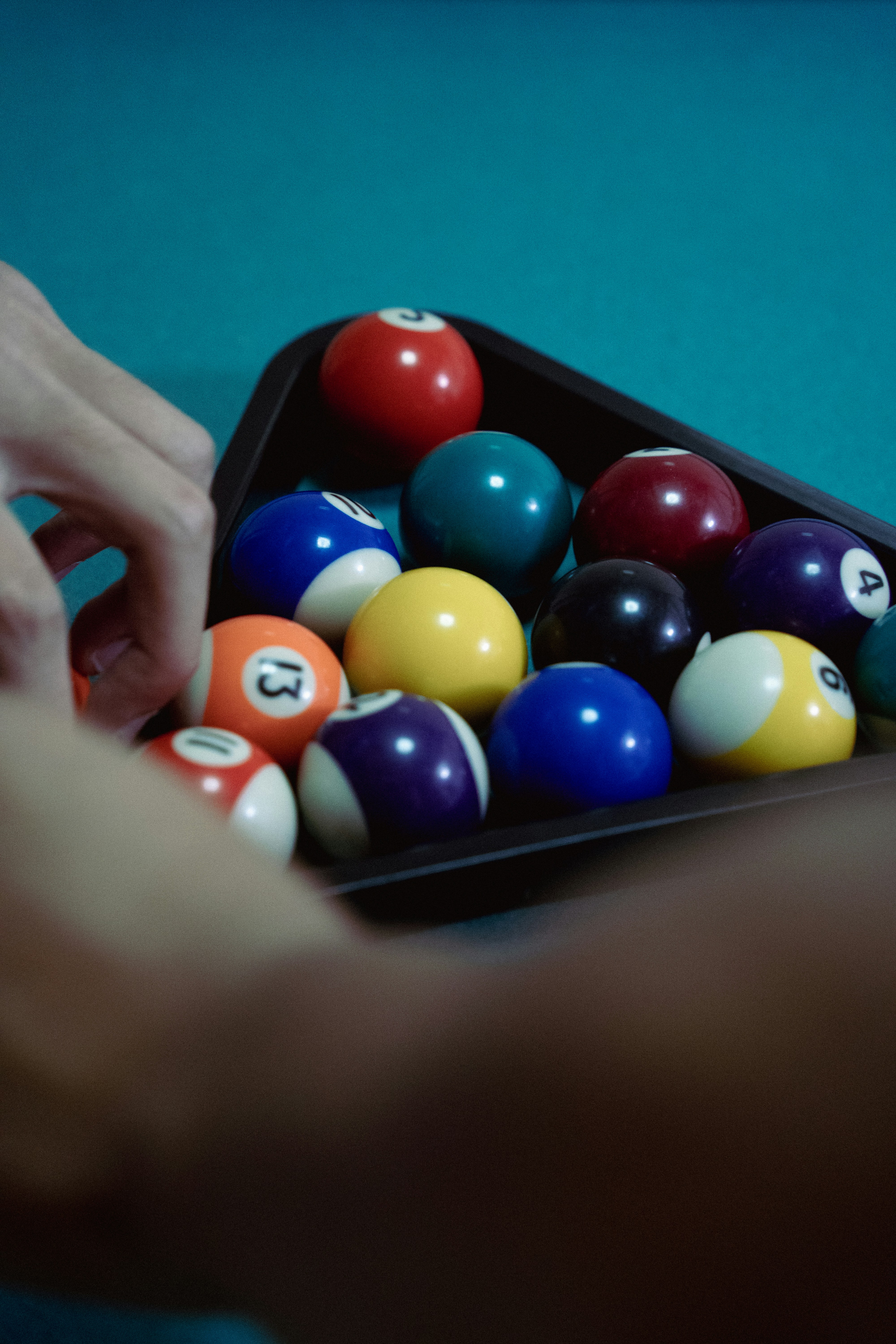 A hand holding a pool table with balls on it photo – Free Billiard ...