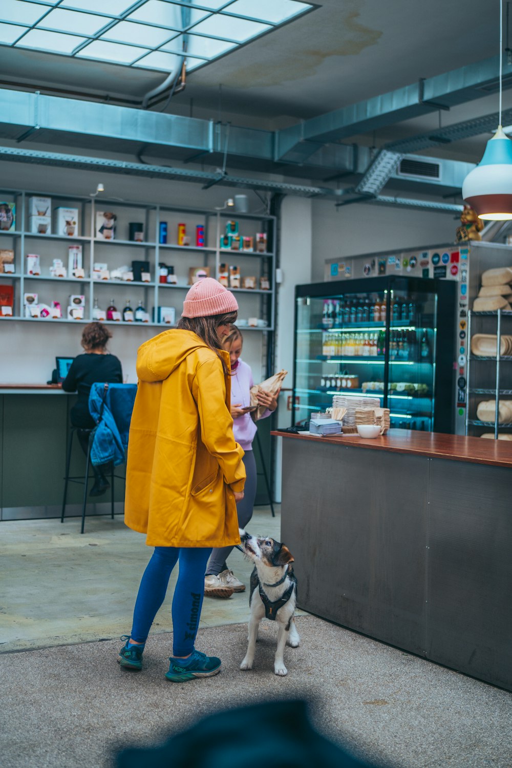 a person and a dog in a store