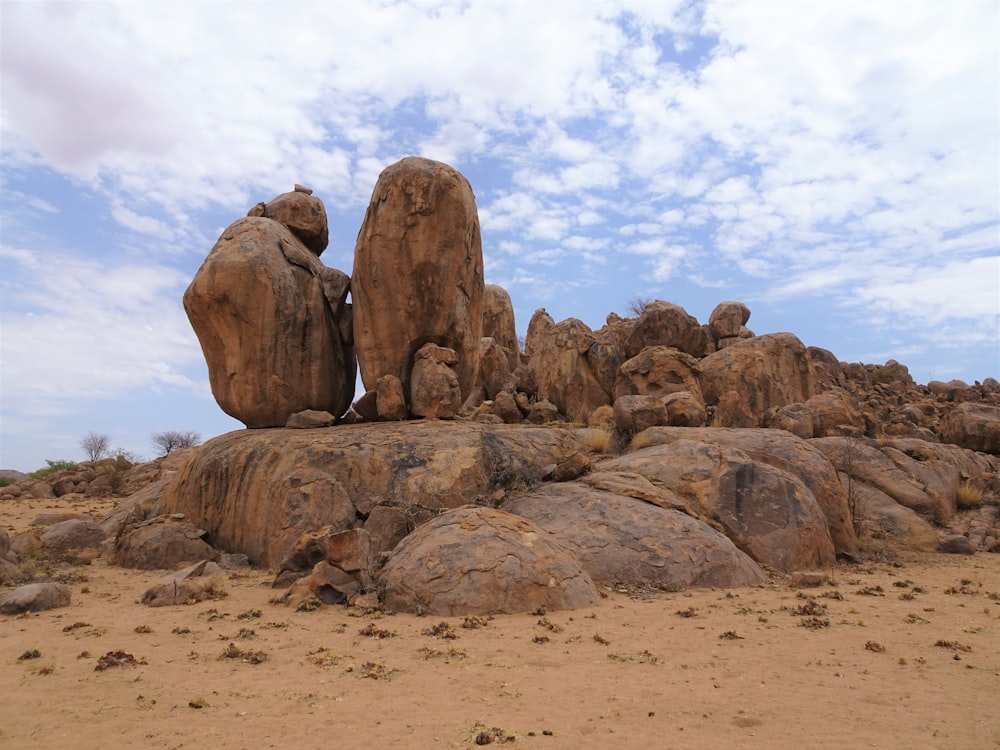 a group of large rocks in a desert