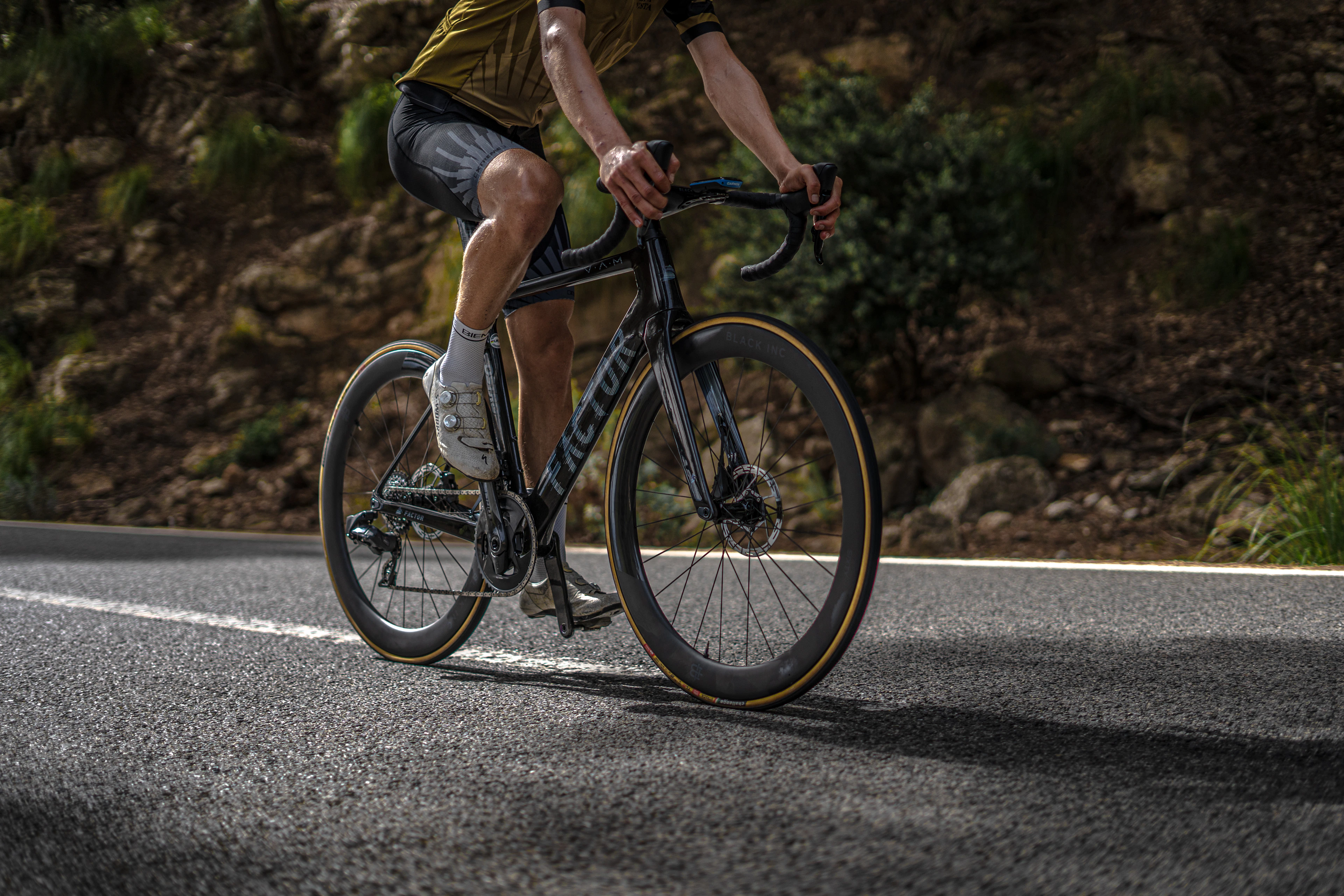 A cyclist training on a quiet road near Caimari in Mallorca