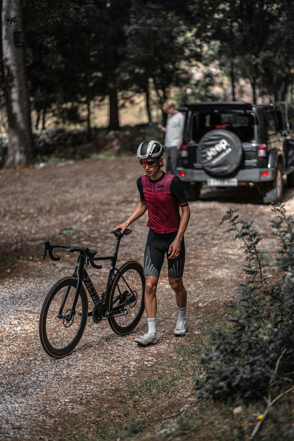 a man holding a bicycle