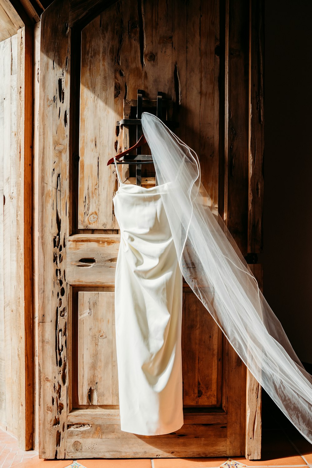 a white dress from a wooden wall