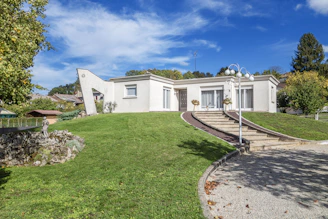 a white house with a lawn